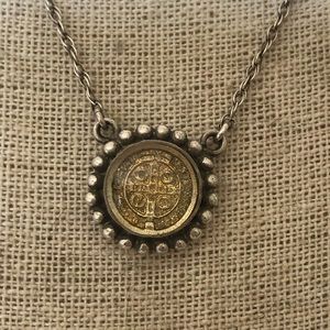 Virgins Saints & Angels medallion necklace in two tone silver and gold.